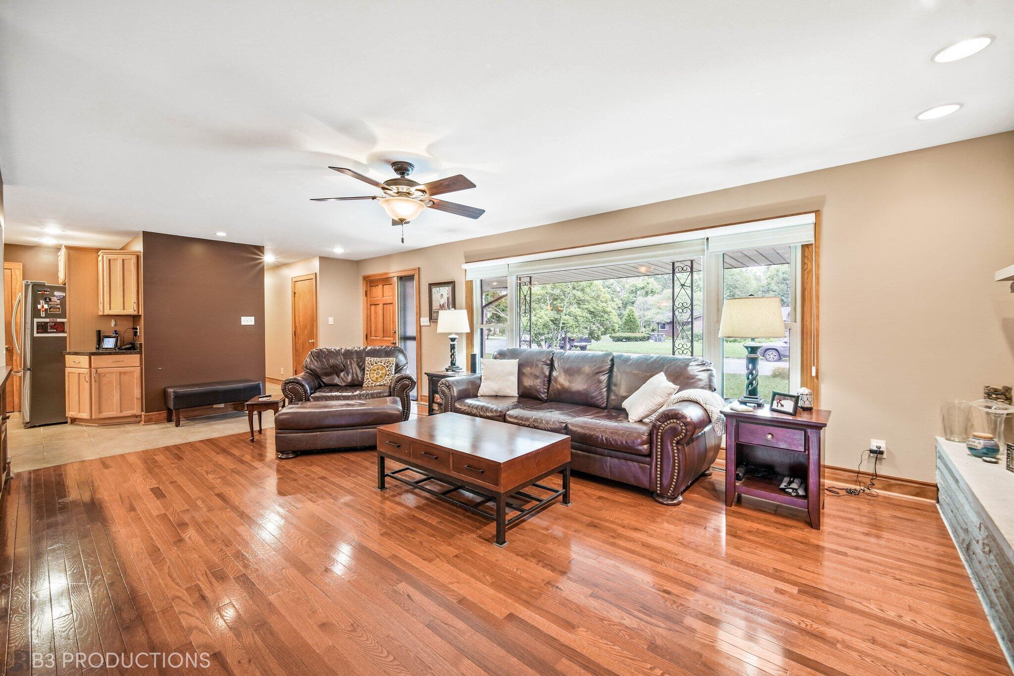 55 Deep River Drive Hobart, IN 46342 - Photo 5 of 21 a living room with furniture and wooden floor