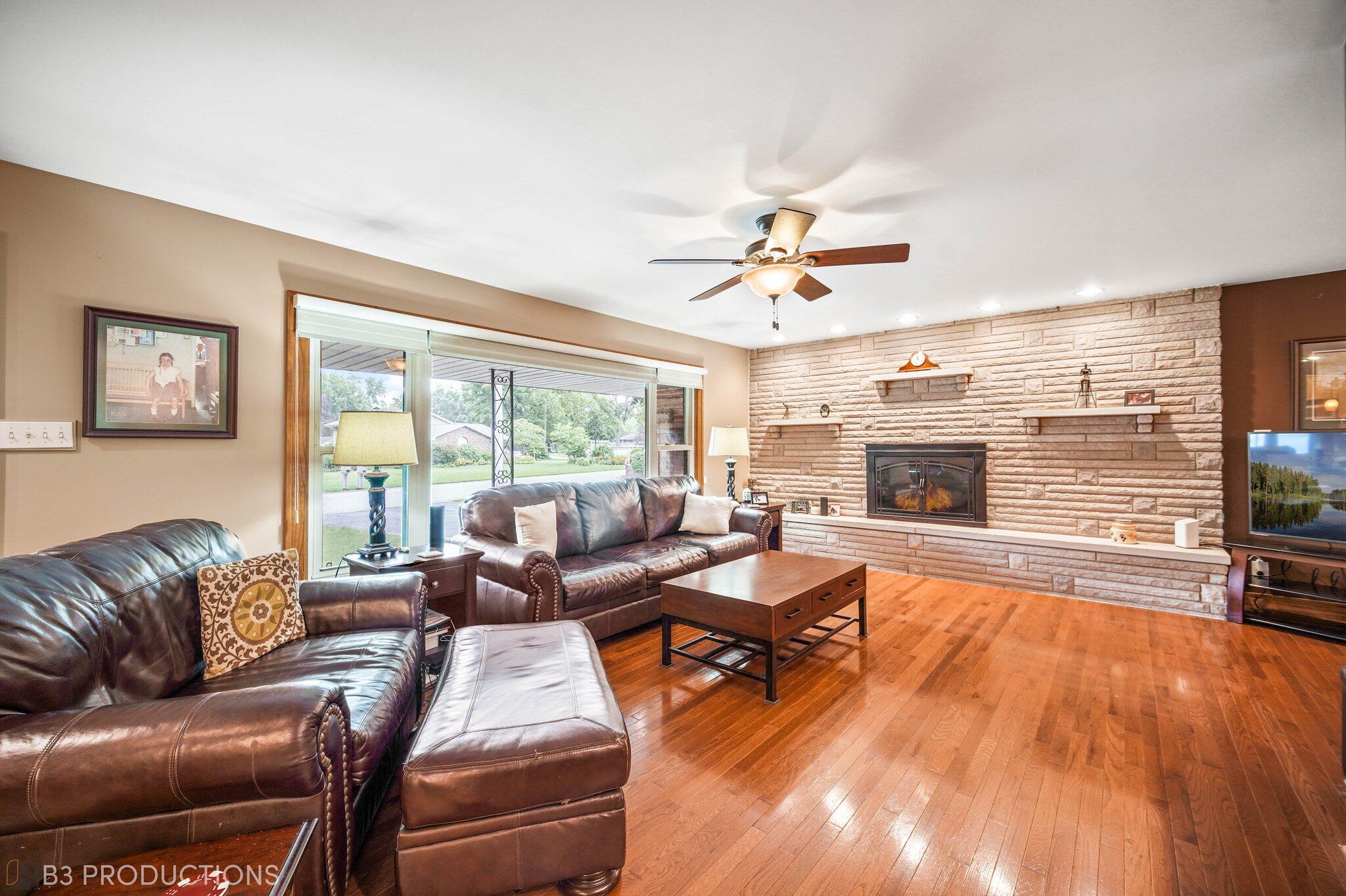 55 Deep River Drive Hobart, IN 46342 - Photo 7 of 21 a living room with furniture fireplace and a large window