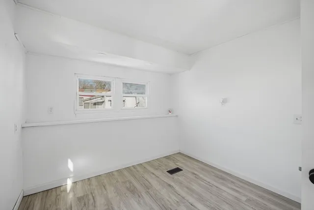 a bathroom with a sink a mirror and vanity