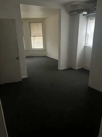 a view of a room that has a window in it