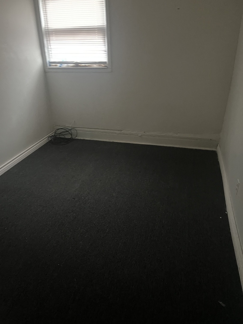 1845 East 93rd Street, Unit 2E Chicago, IL 60617 - Photo 4 of 8 a view of room with window