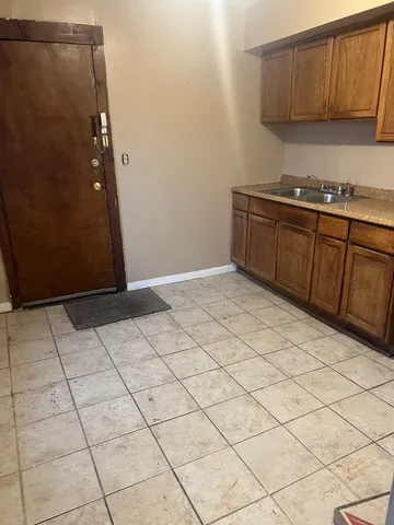 a kitchen with a sink and cabinets