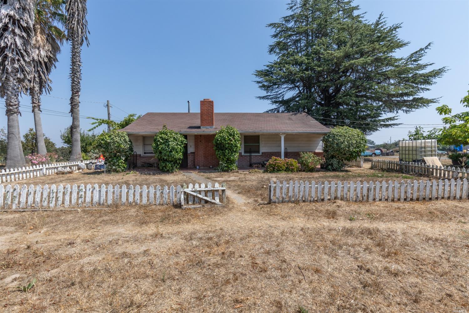 8255 Kennedy Road Sebastopol, CA 95472 - Photo 1 of 1 a view of a house with wooden fence