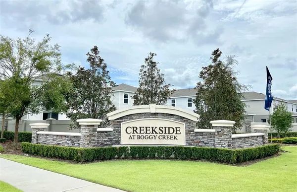 a view of a sign board with a big yard