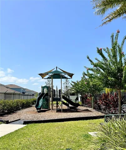 a view of a table and chairs under an umbrella
