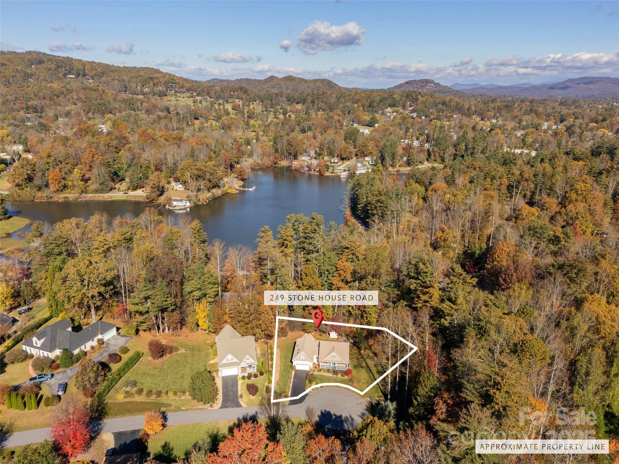 249 Stone House Road Hendersonville, NC 28739 - Photo 33 of 33 an aerial view of residential building and lake