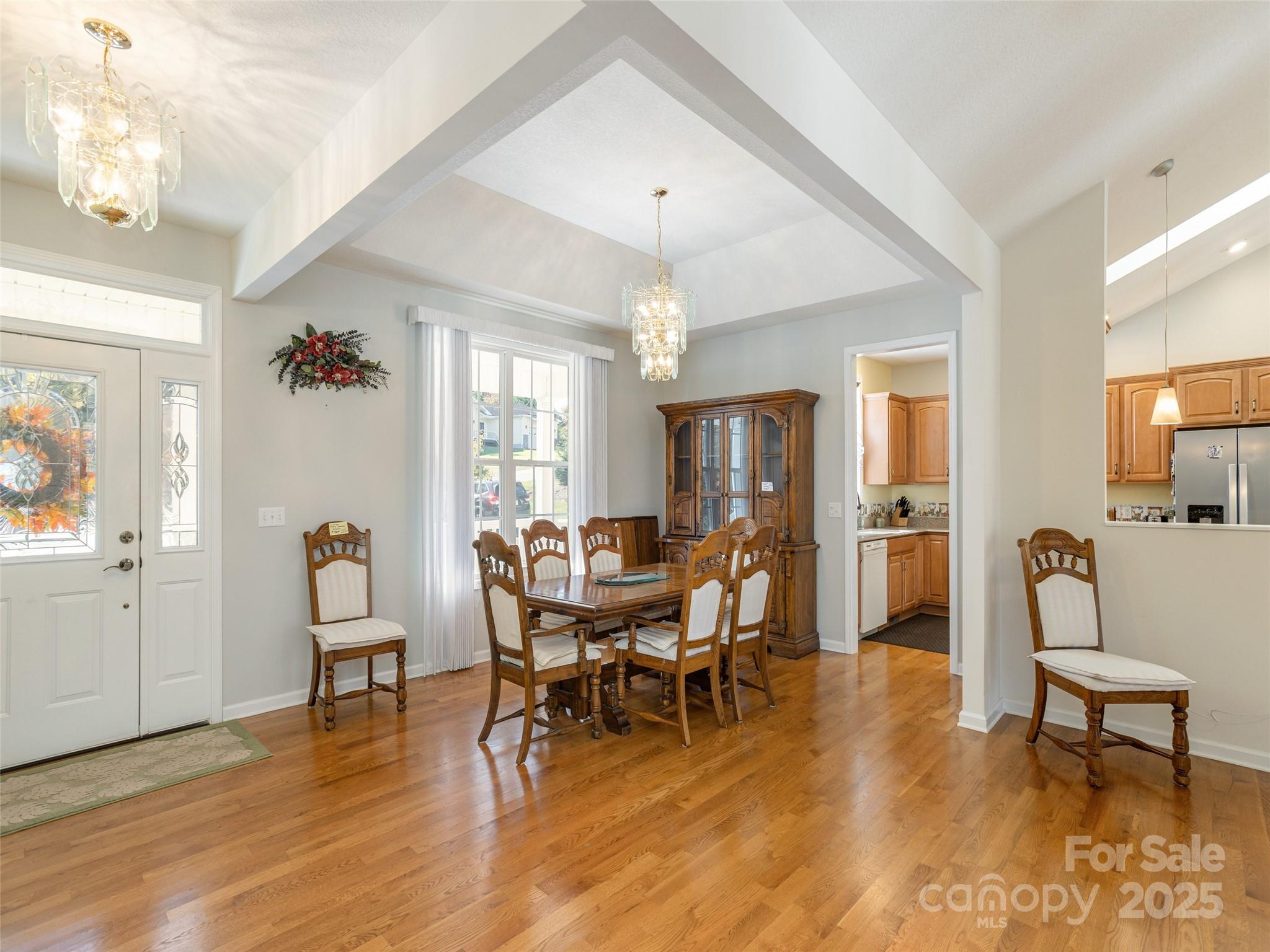 249 Stone House Road Hendersonville, NC 28739 - Photo 4 of 33 a view of a dining room with furniture and wooden floor