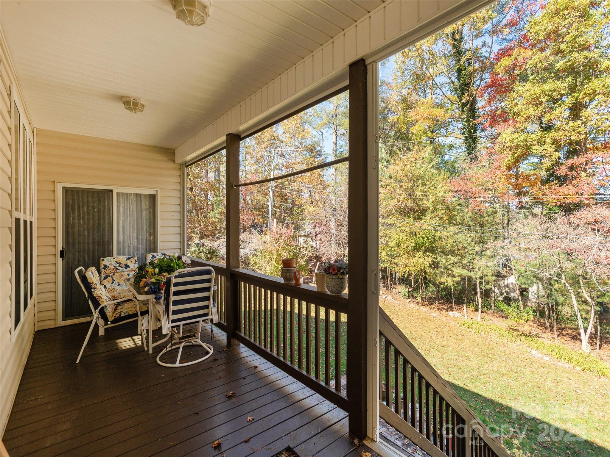 249 Stone House Road Hendersonville, NC 28739 - Photo 7 of 33 a view of a room with wooden floor and furniture