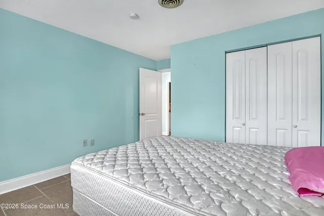 a bedroom with a bed and a cabinets