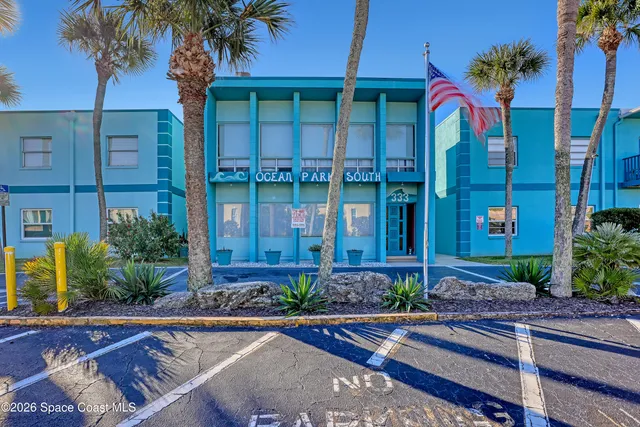 front view of a house with potted plants