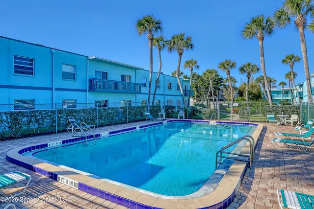 a view of a swimming pool with a patio