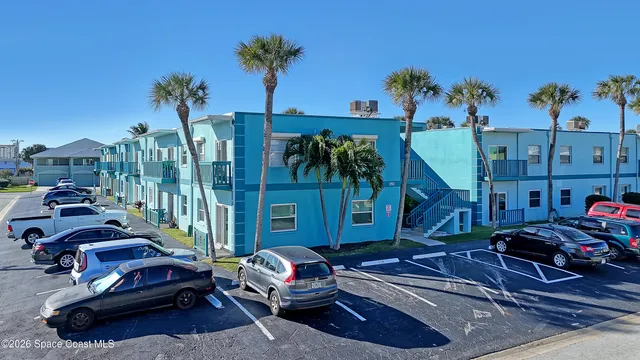 a cars parked in front of a building