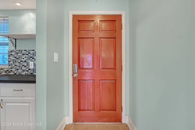 a view of entryway with bathroom