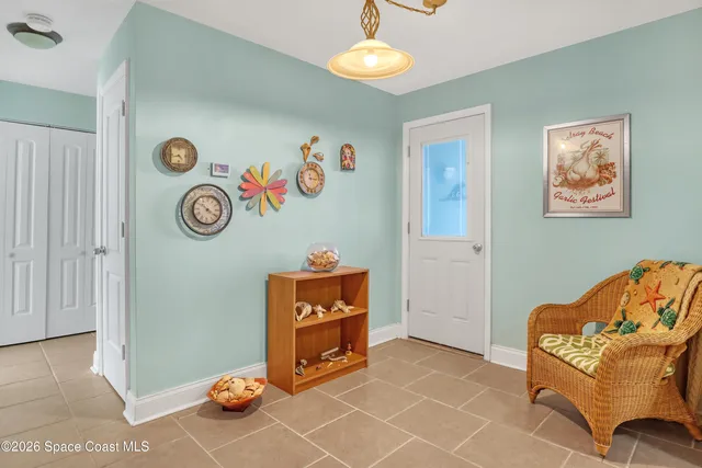 a view of a livingroom with furniture and a chandelier