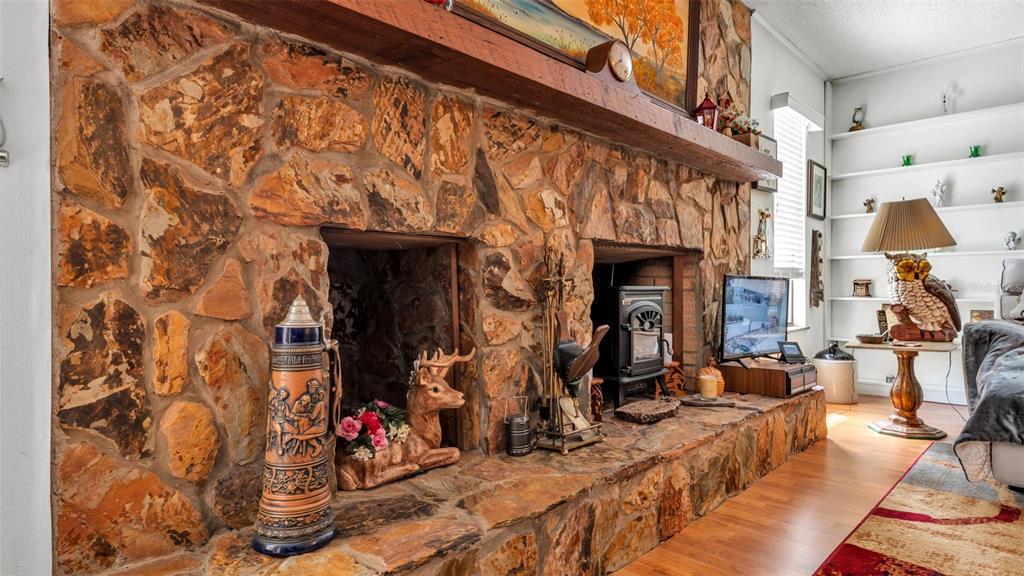 1301 Lanier Road Lakeland, FL 33810 - Photo 17 of 45 a view of living room with furniture and a fireplace