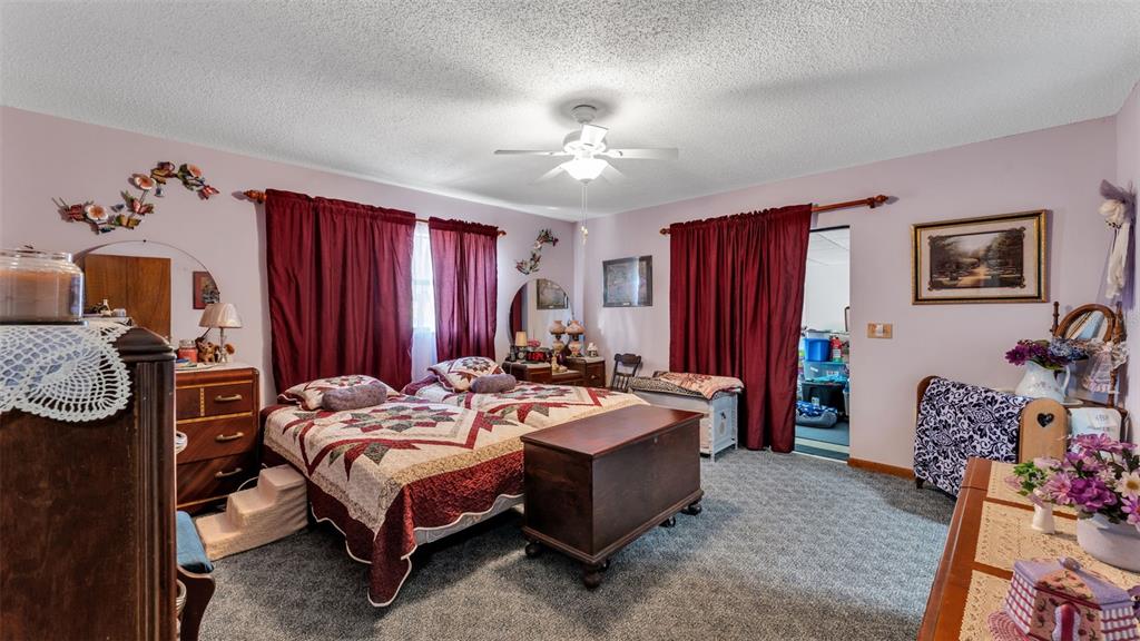 1301 Lanier Road Lakeland, FL 33810 - Photo 25 of 45 a bed room with a bed mirror and a table