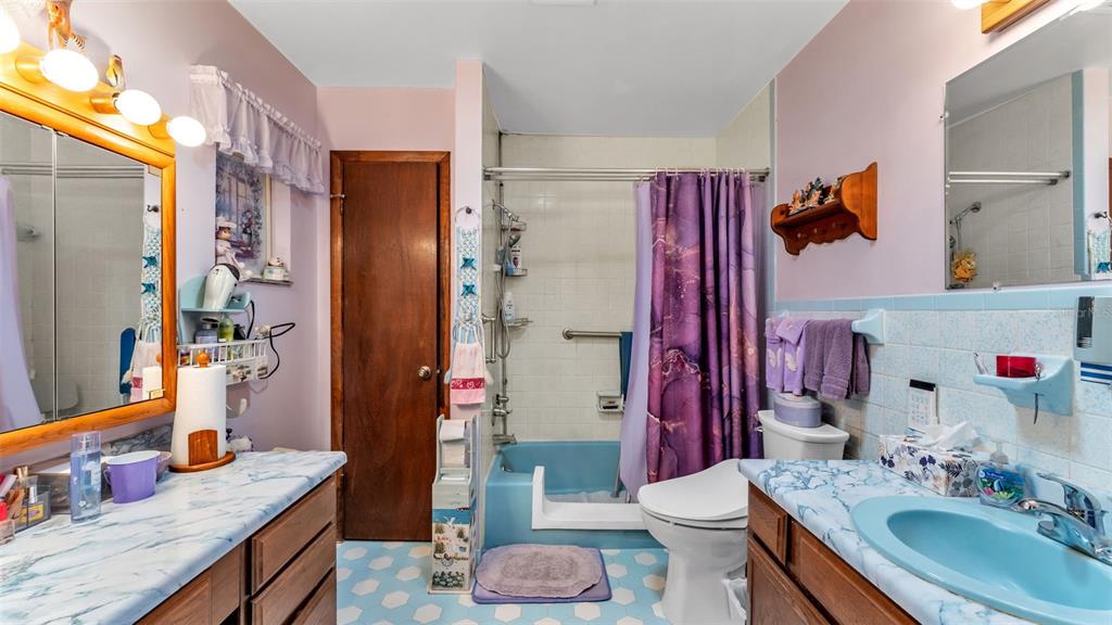 1301 Lanier Road Lakeland, FL 33810 - Photo 28 of 45 a bathroom with a granite countertop sink toilet and shower