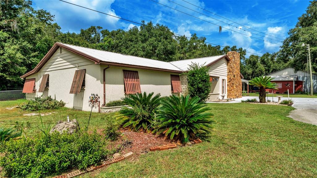 1301 Lanier Road Lakeland, FL 33810 - Photo 3 of 45 a front view of house with yard and green space