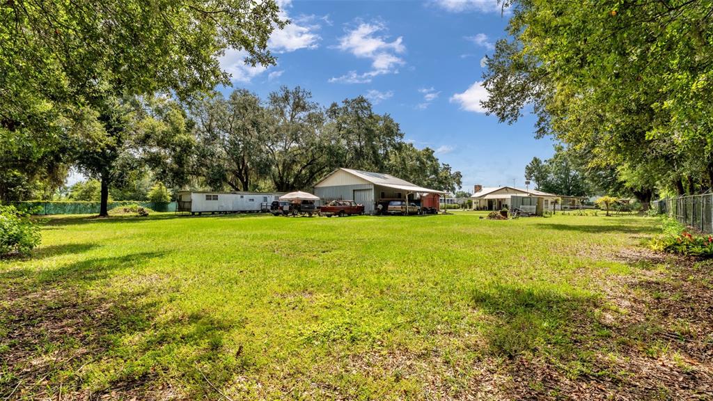 1301 Lanier Road Lakeland, FL 33810 - Photo 34 of 45 a view of a house with yard and green space