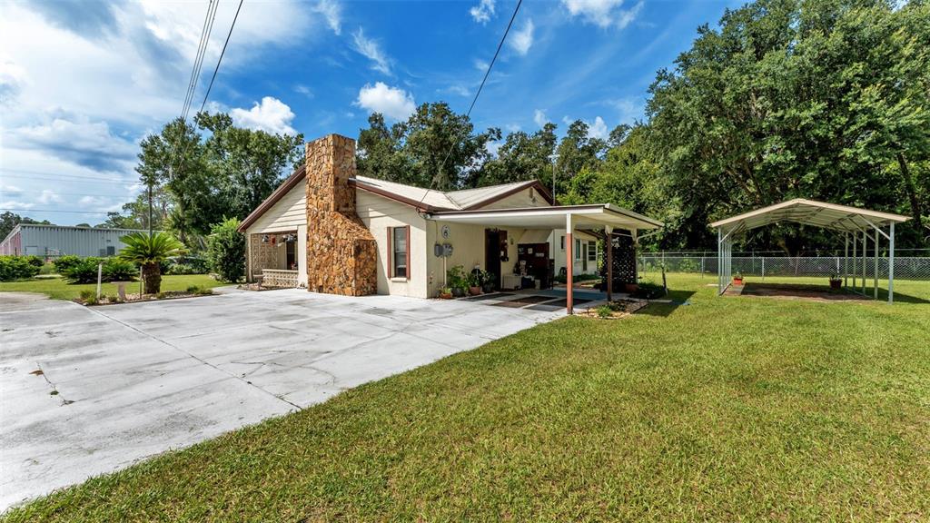 1301 Lanier Road Lakeland, FL 33810 - Photo 4 of 45 a view of house with swimming pool outdoor seating