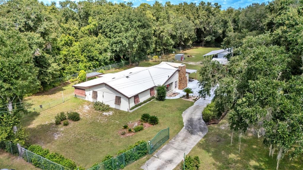 1301 Lanier Road Lakeland, FL 33810 - Photo 41 of 45 an aerial view of a house with a yard basket ball court and outdoor seating