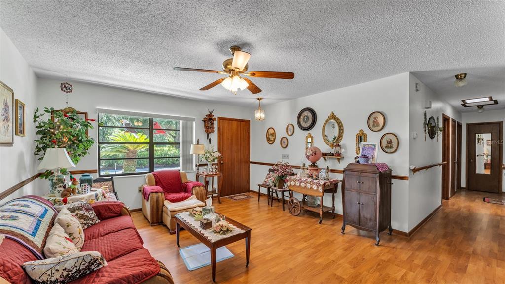1301 Lanier Road Lakeland, FL 33810 - Photo 6 of 45 a living room with furniture gym equipment and a large window