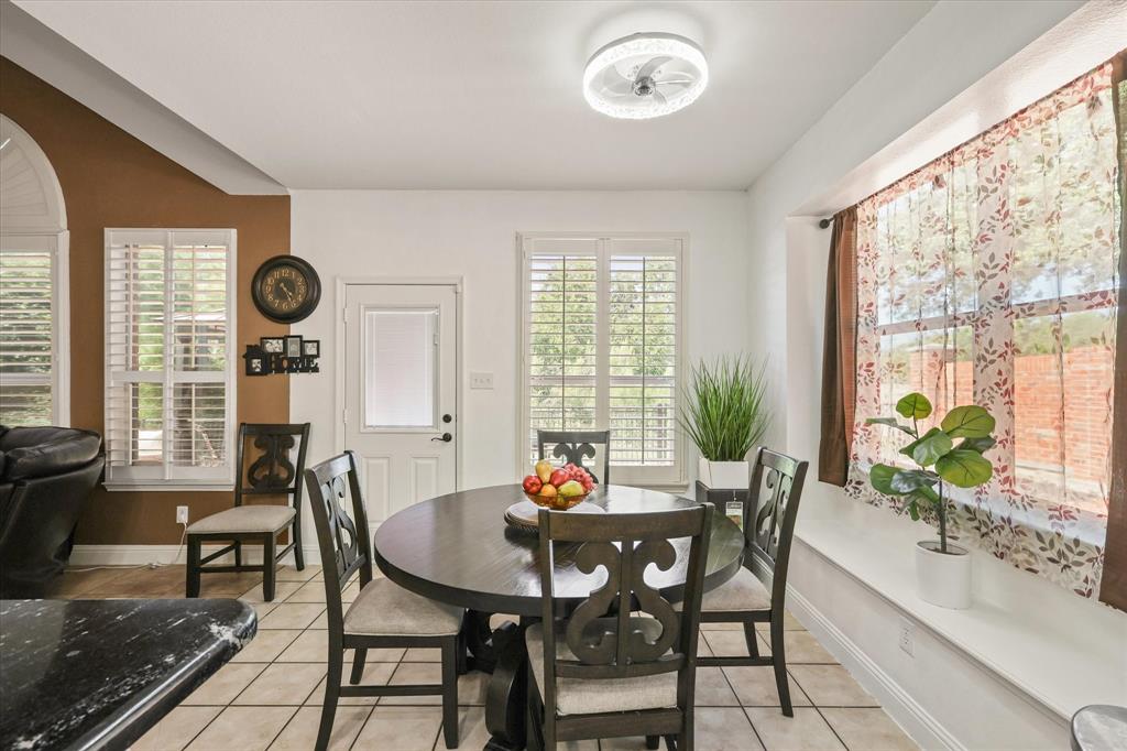 1973 Garrison Way Garland, TX 75040 - Photo 12 of 29 a view of a dining room with furniture window and outside view