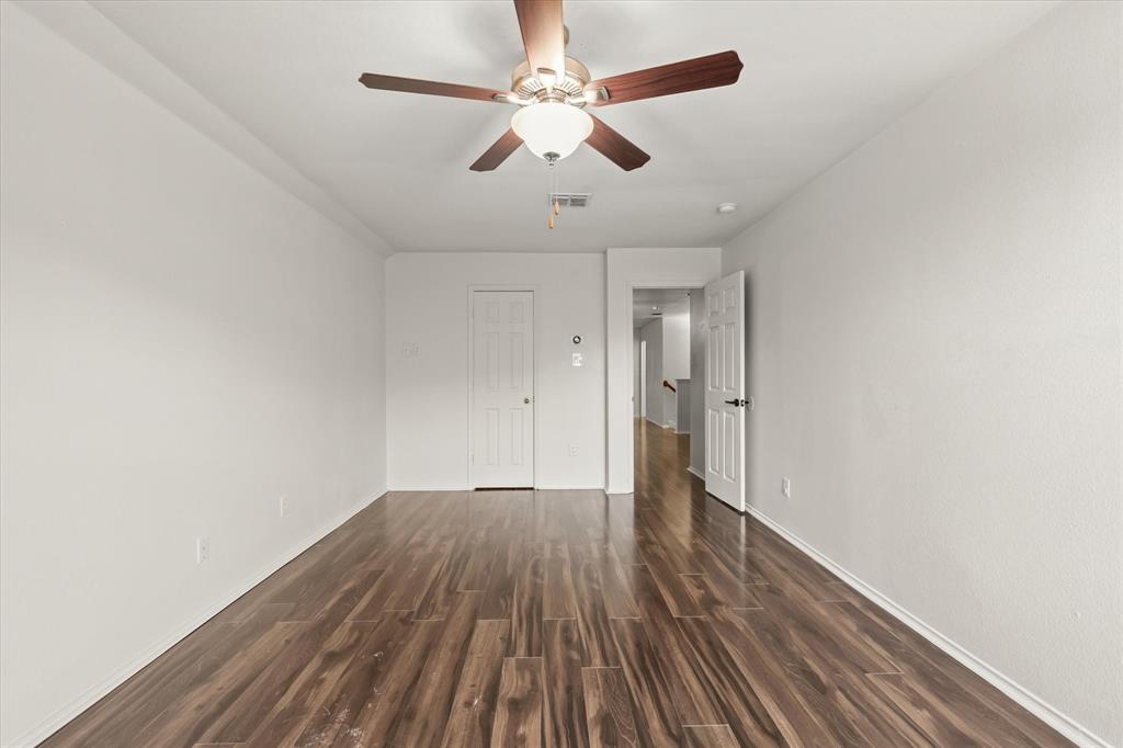 1973 Garrison Way Garland, TX 75040 - Photo 23 of 29 wooden floor in an empty room with a window