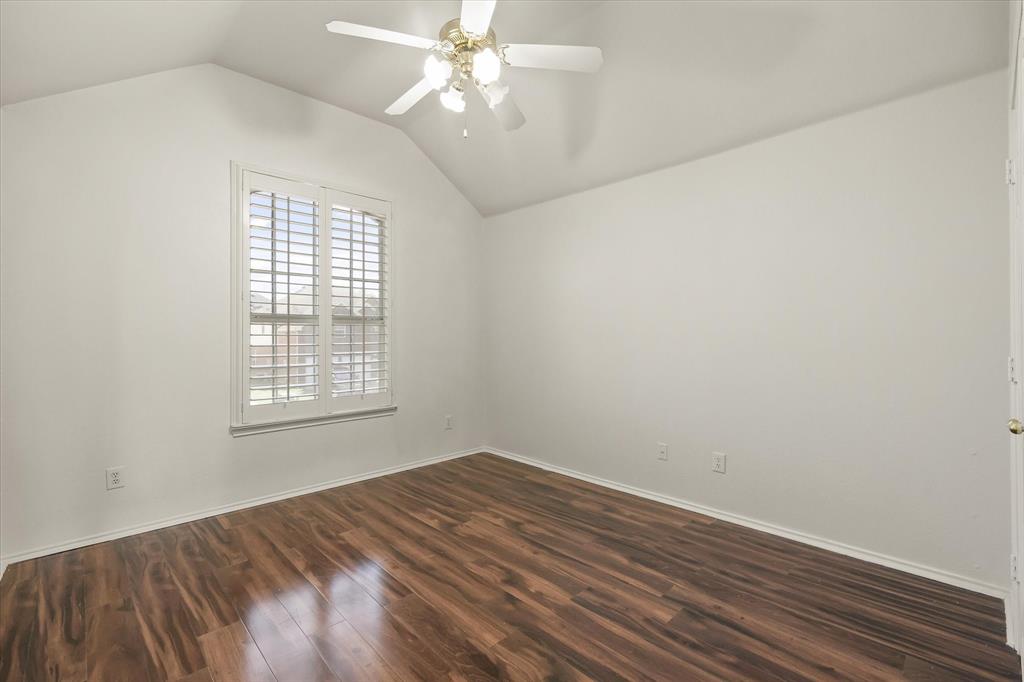 1973 Garrison Way Garland, TX 75040 - Photo 24 of 29 wooden floor in an empty room with a window