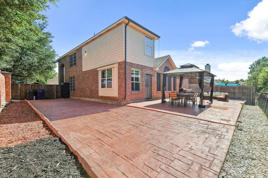 1973 Garrison Way Garland, TX 75040 - Photo 27 of 29 a view of a house with backyard and sitting area