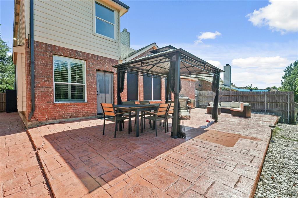 1973 Garrison Way Garland, TX 75040 - Photo 28 of 29 a view of a backyard with sitting area