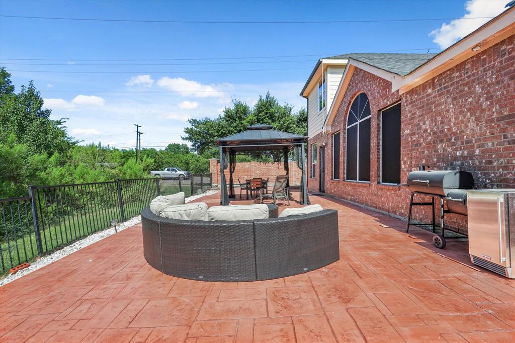 1973 Garrison Way Garland, TX 75040 - Photo 29 of 29 a view of a house with a yard and sitting area