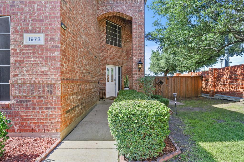 1973 Garrison Way Garland, TX 75040 - Photo 4 of 29 a view of back yard of the house