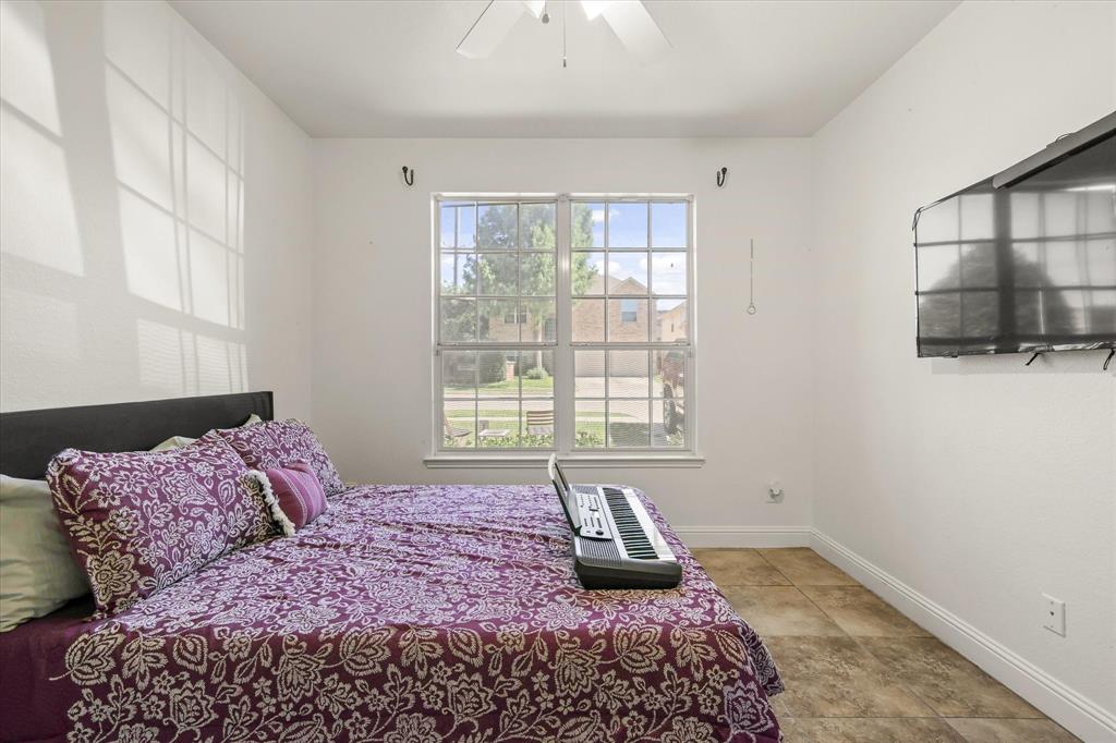 1973 Garrison Way Garland, TX 75040 - Photo 6 of 29 a bedroom with a bed and a window