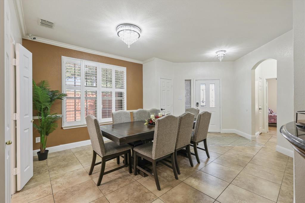 1973 Garrison Way Garland, TX 75040 - Photo 10 of 29 a view of a dining room with furniture and a window