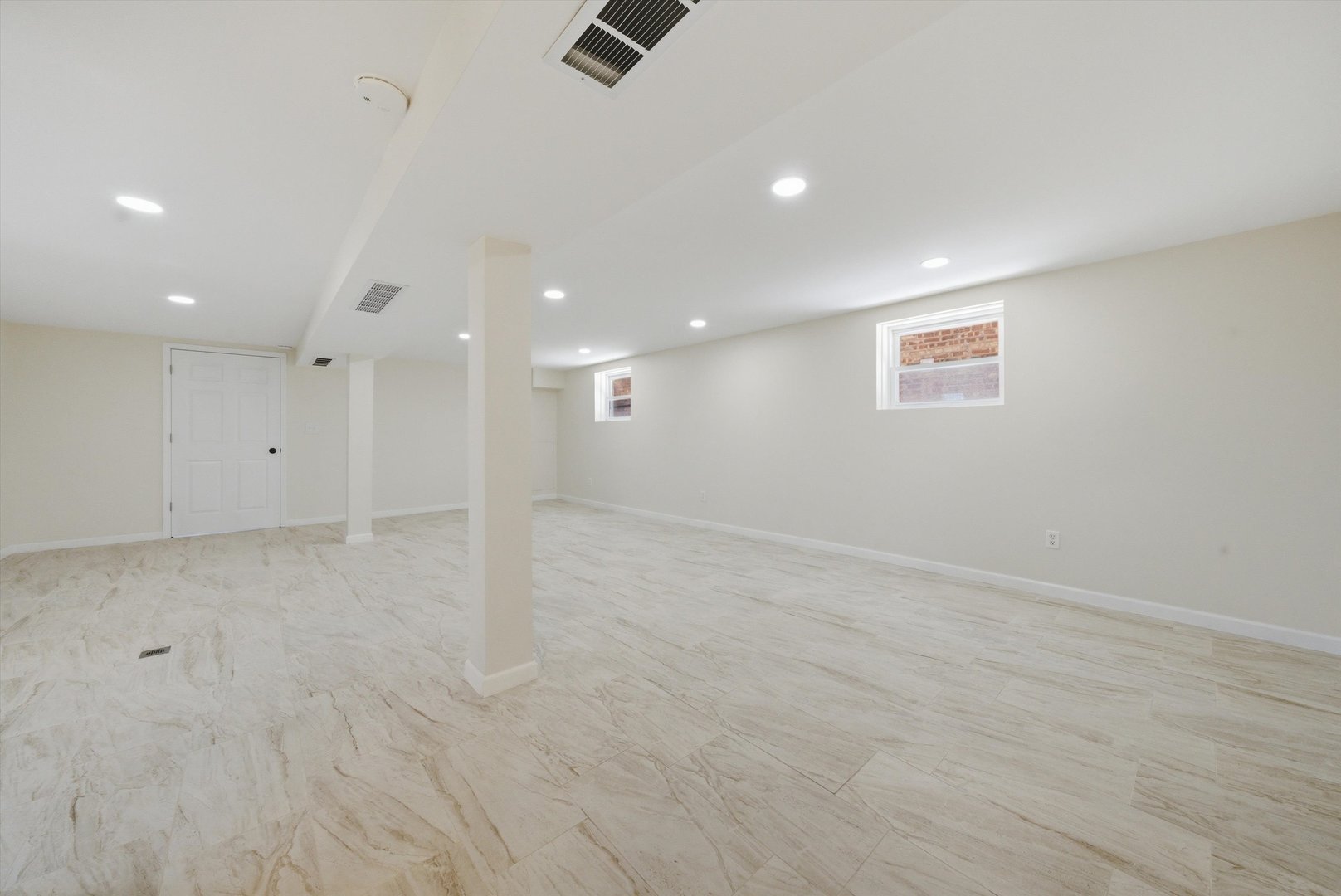 3907 West Marquette Road Chicago, IL 60629 - Photo 28 of 32 an empty room with a ceiling fan & windows