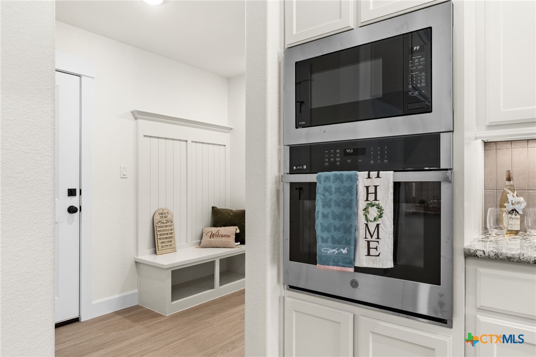 3025 Millhouse Road Copperas Cove, TX 76522 - Photo 12 of 43 a living room with furniture and a fireplace