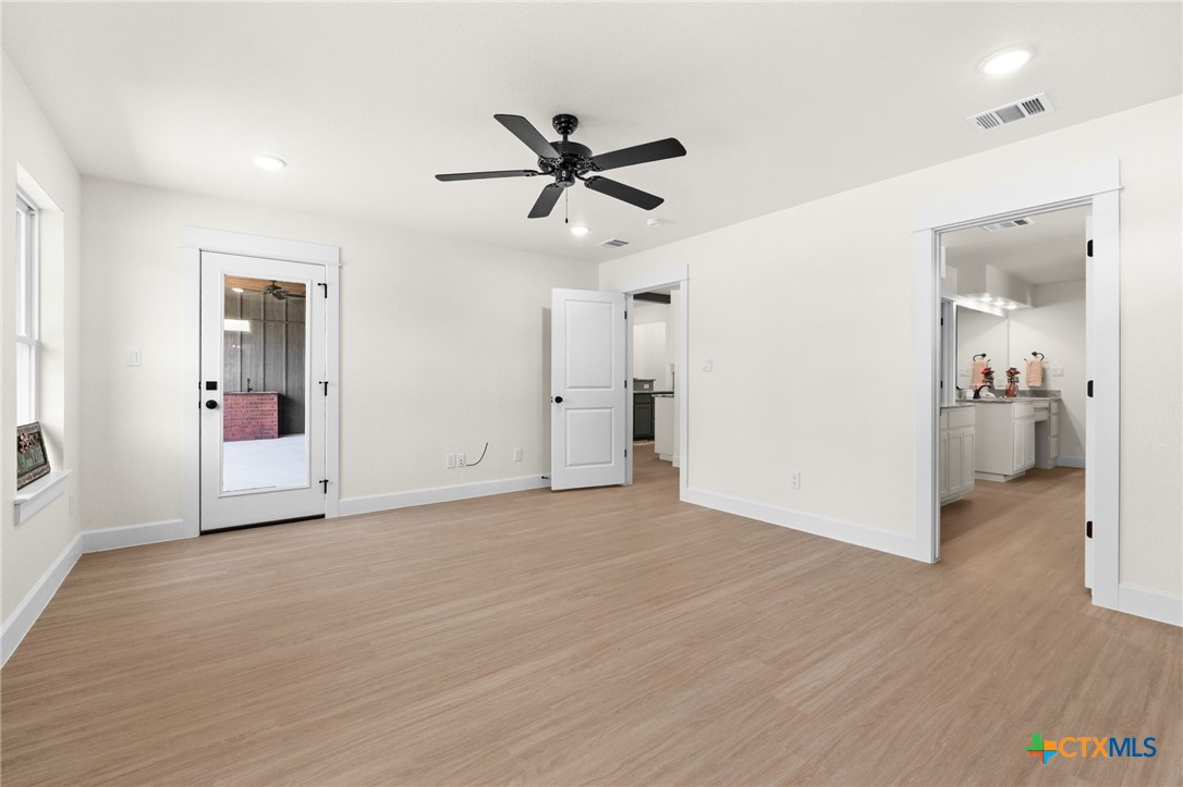 3025 Millhouse Road Copperas Cove, TX 76522 - Photo 16 of 43 a view of livingroom with hardwood floor and a ceiling fan