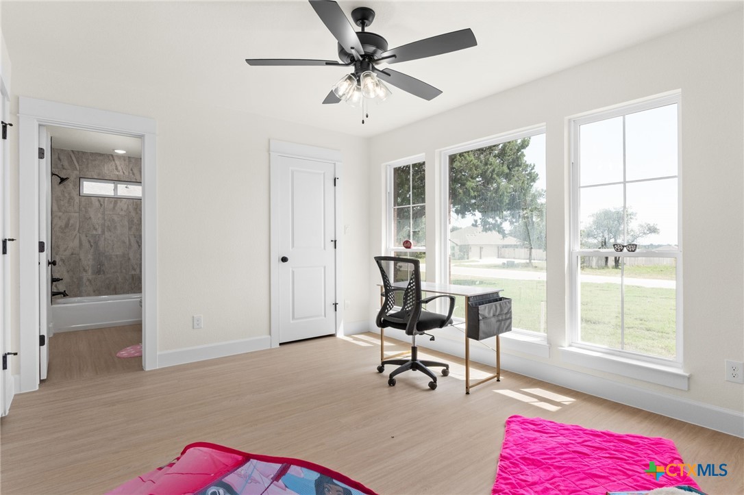 3025 Millhouse Road Copperas Cove, TX 76522 - Photo 23 of 43 a view of a workspace with furniture and a window