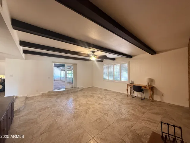 an aerial view of a house with a garden and lake view