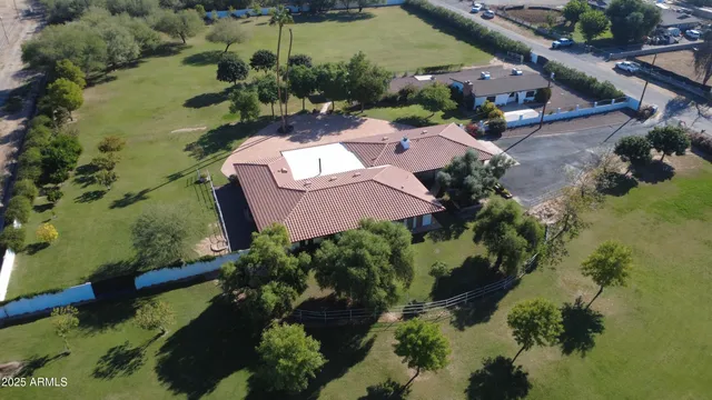 a living room with furniture and a ceiling fan