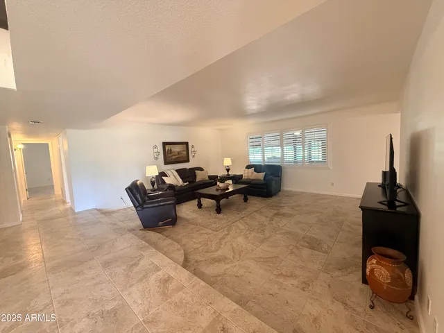 a house view with swimming pool in front of it