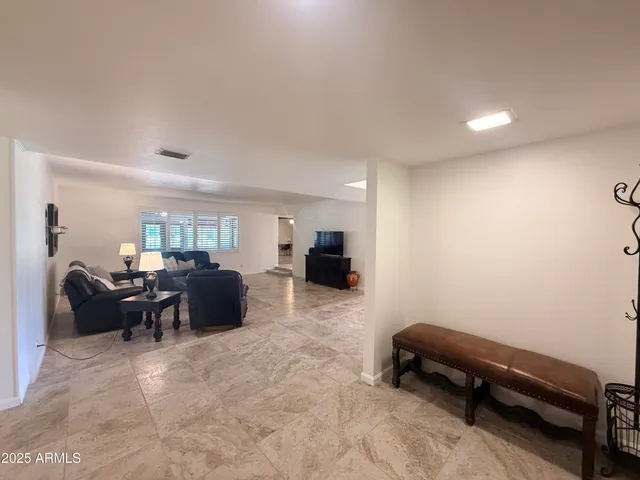 a view of a house with a yard and sitting area