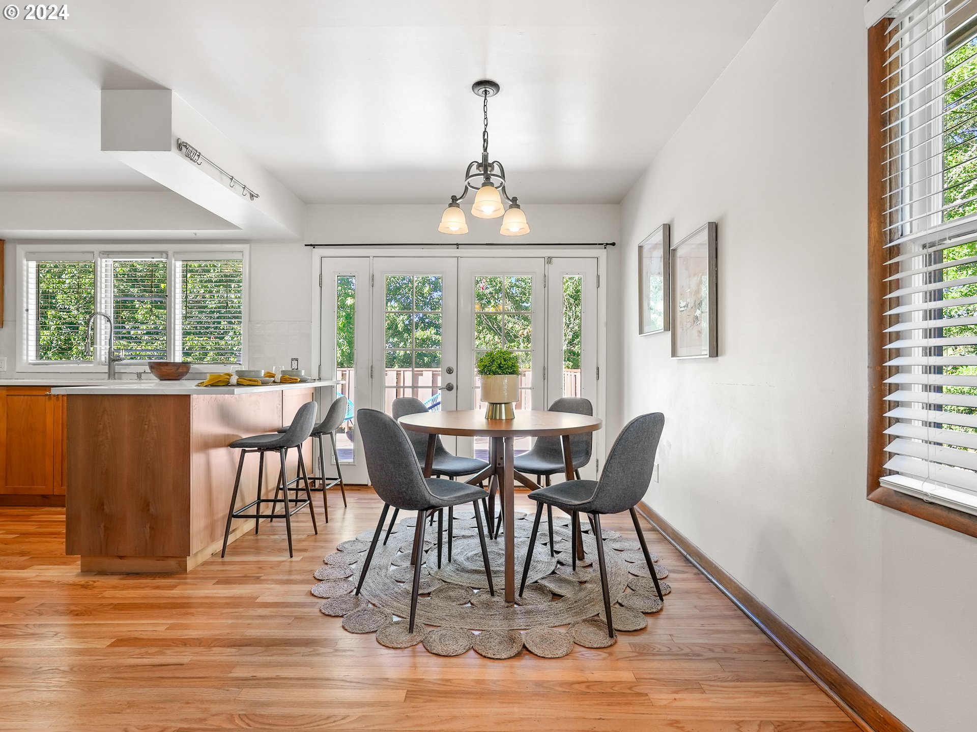 5525 Southwest Florida Street Portland, OR 97219 - Photo 11 of 44 a view of a dining room with furniture window and wooden floor