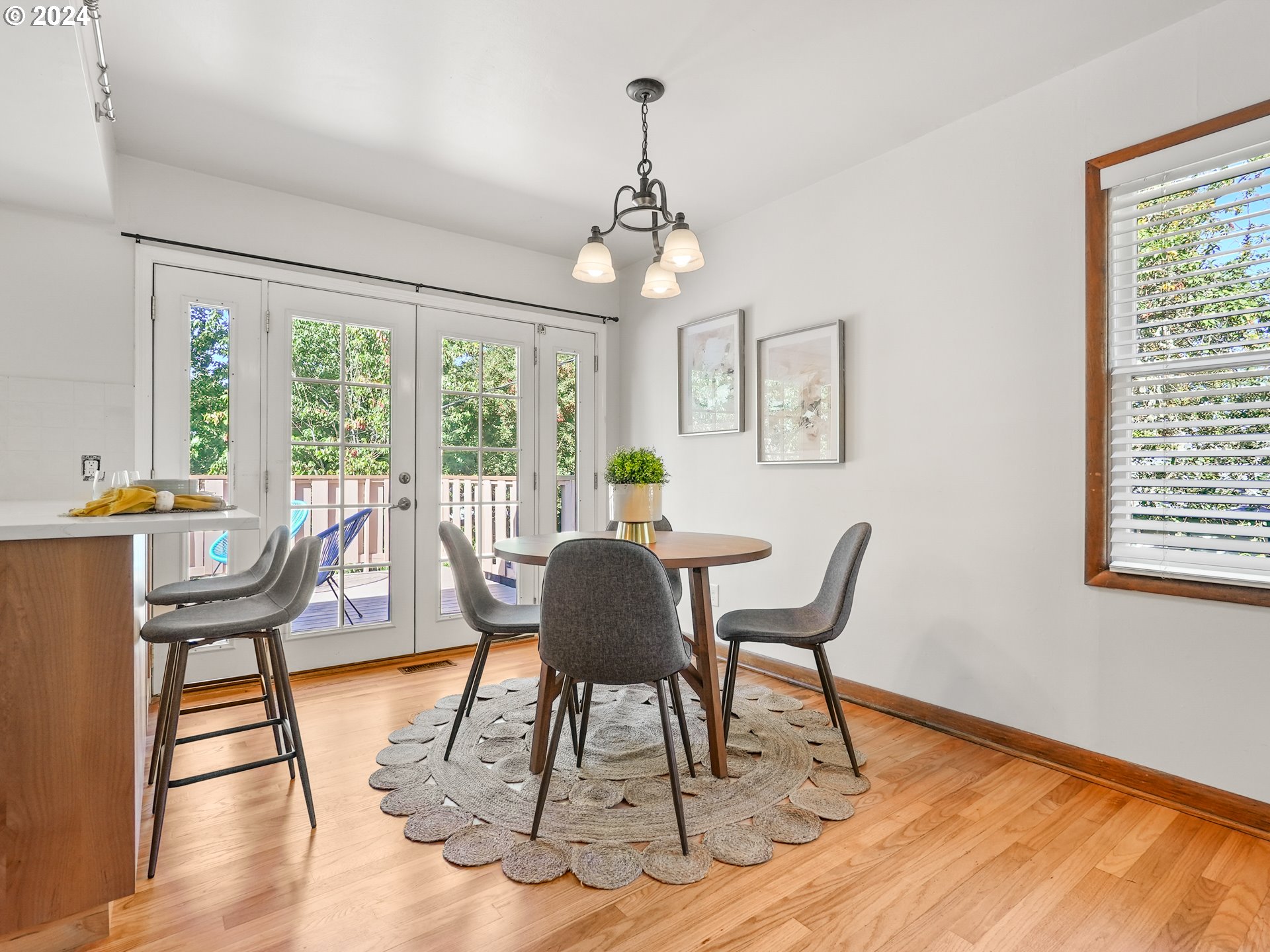 5525 Southwest Florida Street Portland, OR 97219 - Photo 12 of 44 a view of a dining room with furniture window and wooden floor