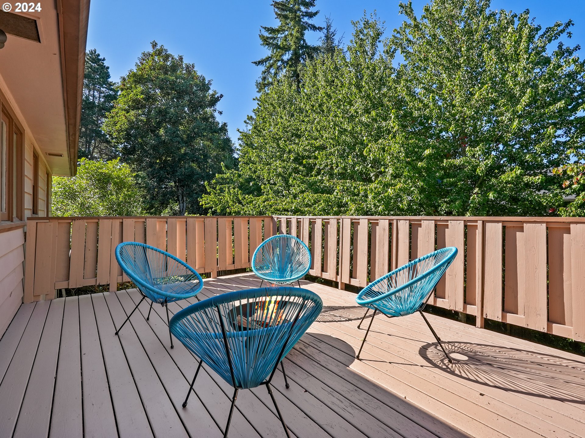 5525 Southwest Florida Street Portland, OR 97219 - Photo 16 of 44 a view of a chairs on wooden deck