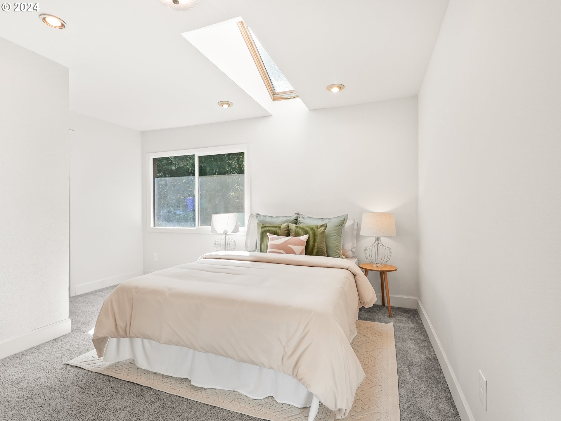 5525 Southwest Florida Street Portland, OR 97219 - Photo 19 of 44 a bedroom with a bed and a window