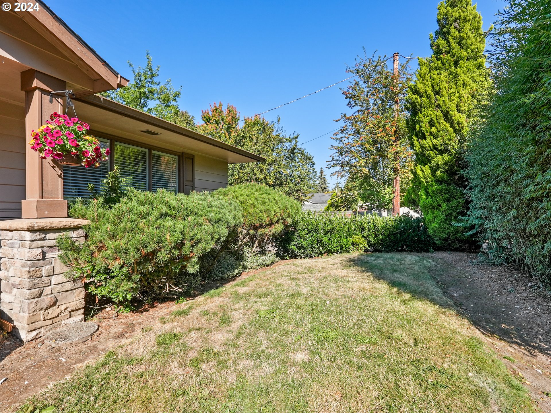 5525 Southwest Florida Street Portland, OR 97219 - Photo 2 of 44 a front view of a house with a yard