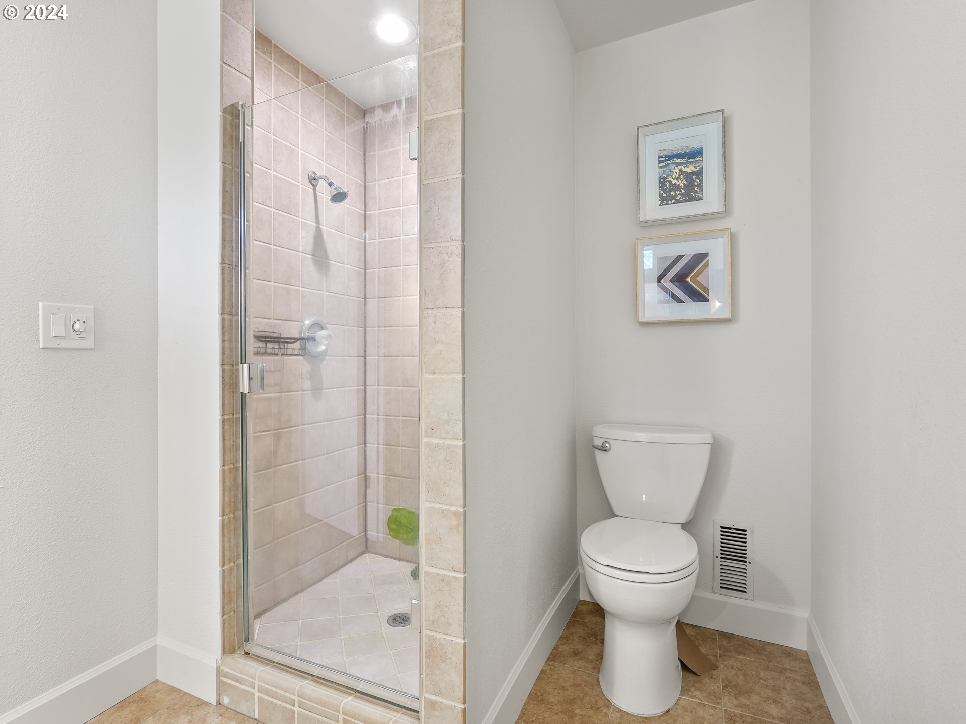 5525 Southwest Florida Street Portland, OR 97219 - Photo 21 of 44 a white toilet sitting next to a bathroom sink