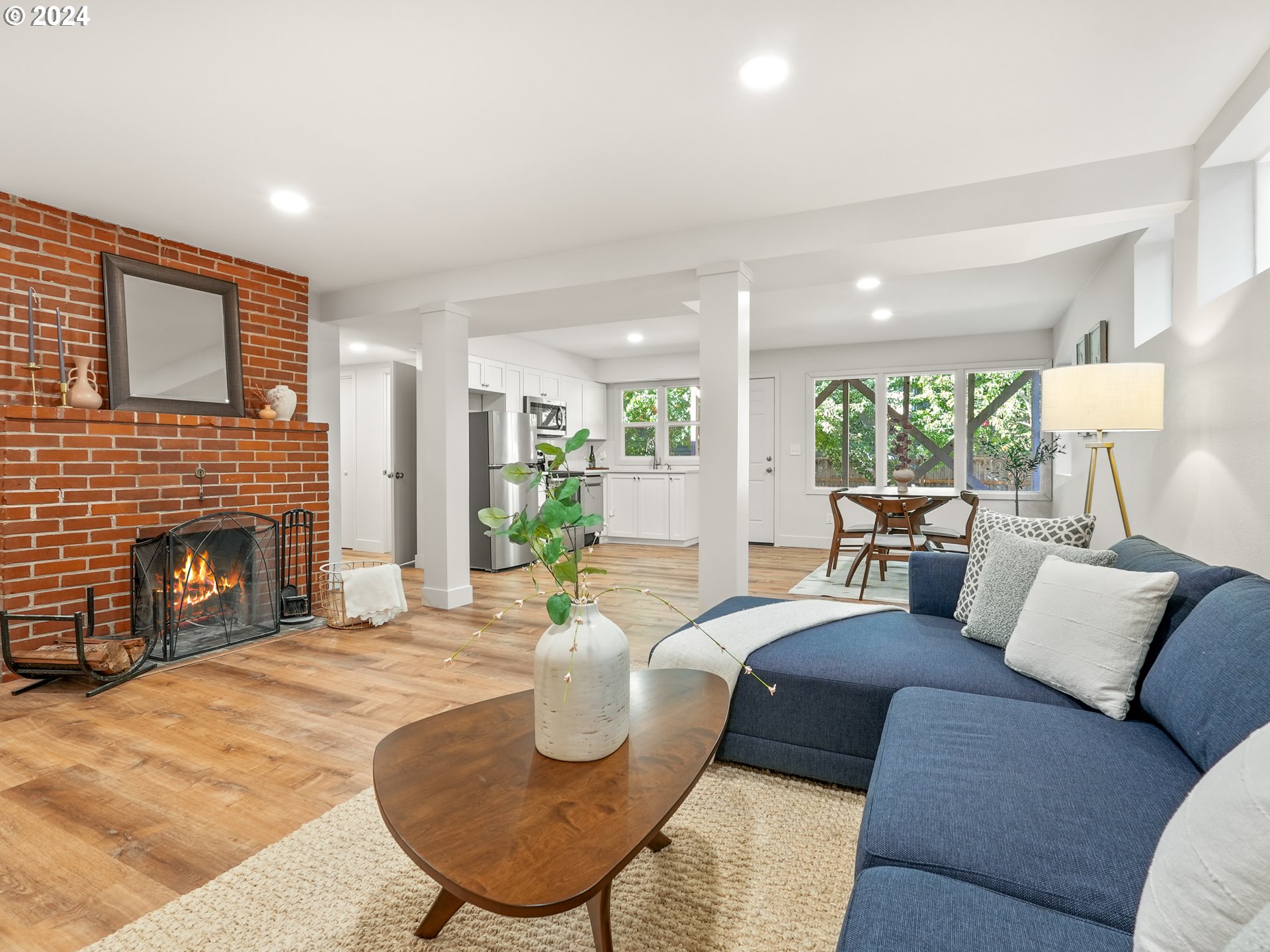 5525 Southwest Florida Street Portland, OR 97219 - Photo 26 of 44 a living room with furniture and a fireplace